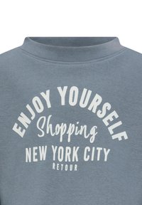 Felpa grigia in cotone con scollatura rotonda e testo stampato: "DIVERTITI A SHOPPARE A NEW YORK CITY RETOUR" in bianco.