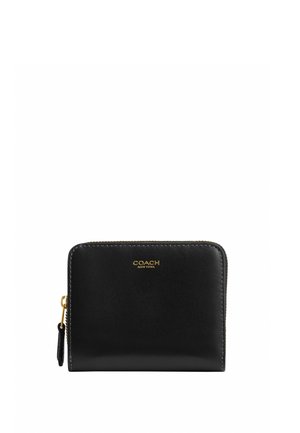 Portefeuille Coach en cuir noir avec fermeture éclair tout autour, logo doré et tirette, texture lisse, forme rectangulaire aux coins arrondis.