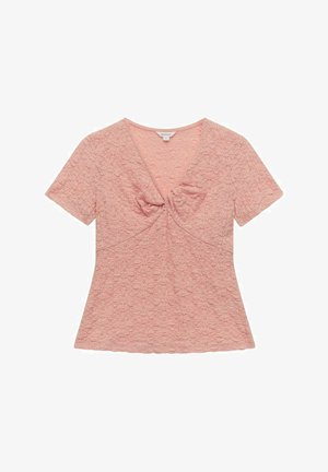 Haut rose clair à manches courtes avec un motif floral texturé, décolleté en V, et un détail de nœud froncé au centre devant. Coupe régulière.