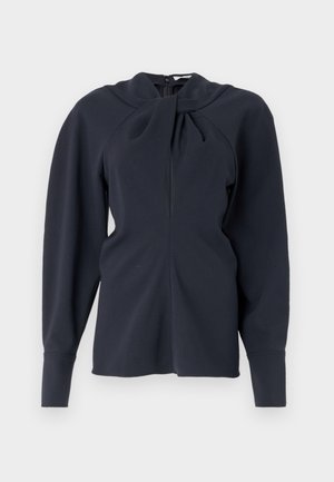 Camisola de manga longa azul marinho com colarinho dobrado, fecho frontal com zipper e ombros estruturados. Tecido suave com textura mínima.