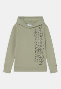 Felpa con cappuccio verde oliva con tasca a marsupio, polsini e orlo a costine, con testo nero che mostra "Calvin Klein Jeans" lungo un lato.