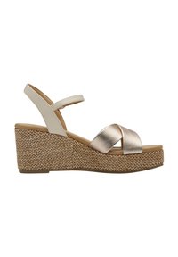 Sandalias de cuña con una plataforma de tejido marrón claro. Tiras cruzadas metálicas doradas y correa para el tobillo ajustable. Material superior suave de color crema claro.