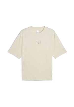 Beige kortærmet t-shirt lavet af bomuld. Har en rund halsudskæring og et diskret "PUMA" logo midt foran. Løs pasform.