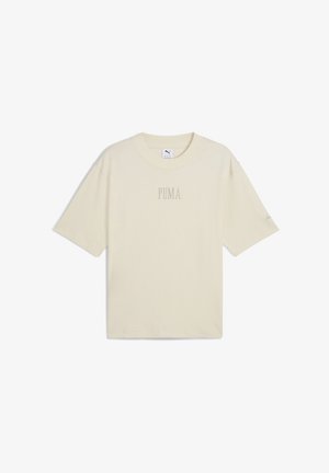 Beige, rövid ujjú póló, pamutból készült. Kerek nyakkivágással és diszkrét "PUMA" logóval a középső elülső részen. Lazán illeszkedő fazon.