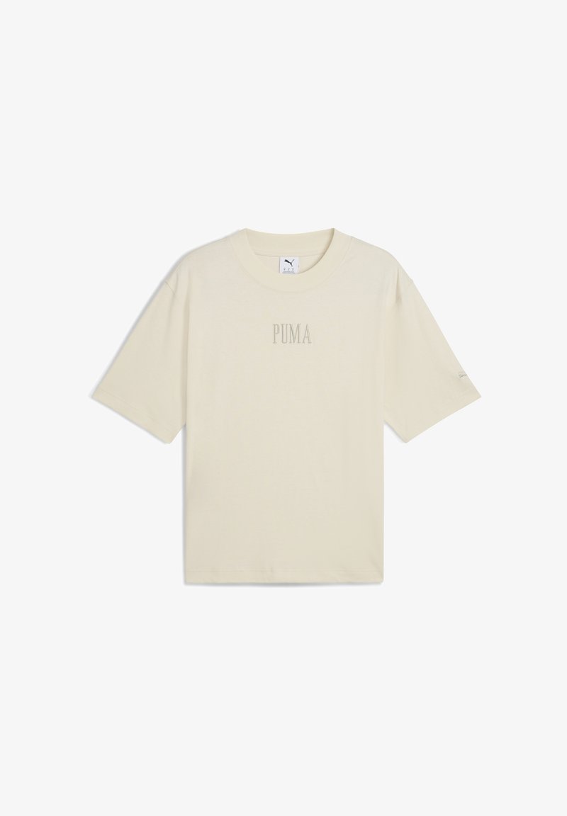 Beige T-Shirt mit kurzen Ärmeln aus Baumwolle. Merkmale einen runden Halsausschnitt und ein dezentes "PUMA"-Logo auf der Vorderseite. Lockere Passform.