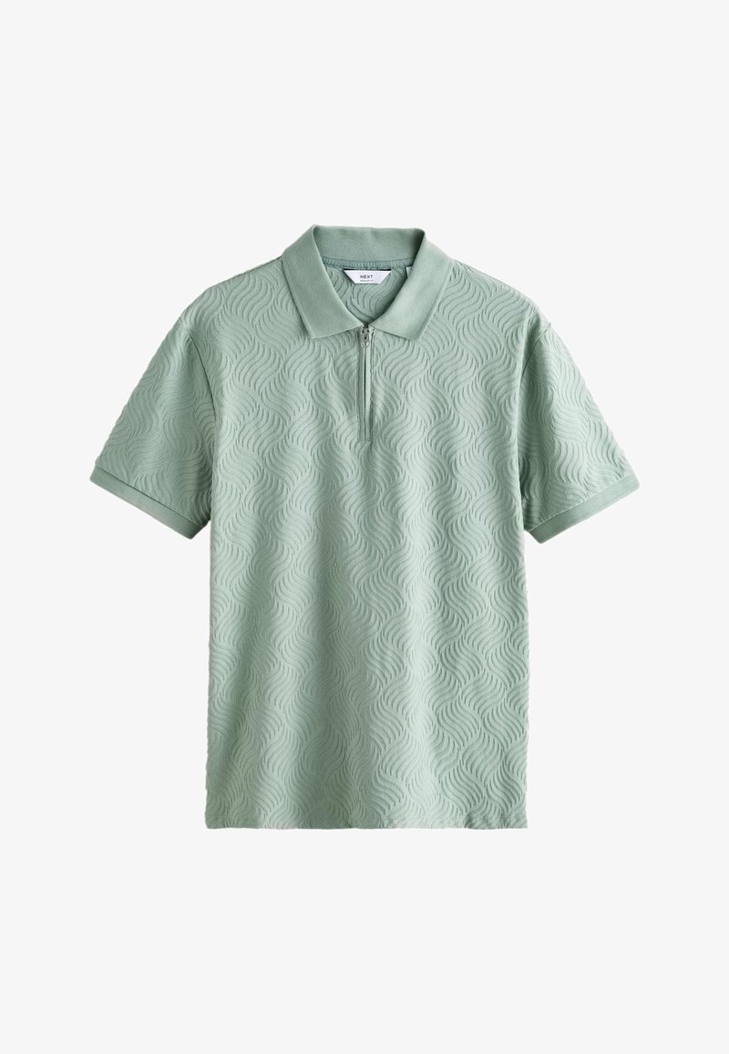 Light green short-sleeve polo shirt with a textured wavy pattern and a front zipper below the collar.