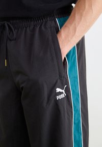Puma PLAY PARIS TRACK PANTS - Tepláky - black