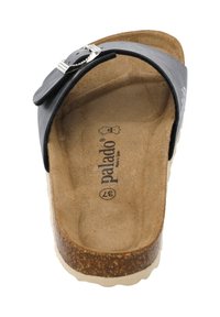 Black leather slide sandal with a silver buckle and cork sole. Soft brown footbed with embossed brand name and size. Flat design with open toe.