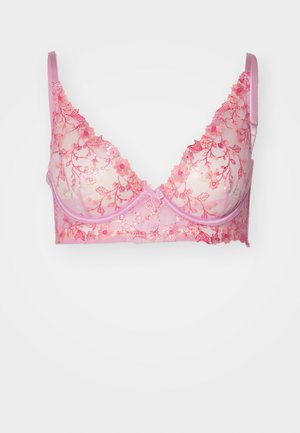 Pink lace bralette with floral embroidery, sheer cups, and adjustable straps. Features a bow accent at the center and a soft finish.