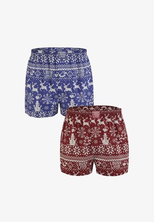 Blaue Badeshorts mit einem festlichen weißen Muster aus Rentieren und Schneeflocken. Elastischer Bund, lockere Passform und keine sichtbaren Taschen.