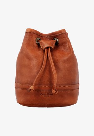 Brown leather drawstring bucket bag with metal eyelets and embossed brand name near the bottom center.