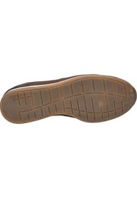 Gumowa podeszwa o teksturowanym, brązowym wykończeniu. Posiada sześciokątny wzór oraz liczne rowki dla lepszej przyczepności i elastyczności.