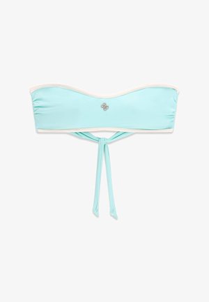 Jasnoniebieski top bikini typu bandeau z białą lamówką, małą srebrną emblematą na środku z przodu oraz zawiązanymi rzemykami zwisającymi na dole.