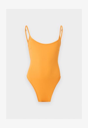 Φωτεινό πορτοκαλί ολόσωμο μαγιό με λεπτές ρυθμιζόμενες τιράντες σε μονόχρωμο ανοιχτό γκρι φόντο.