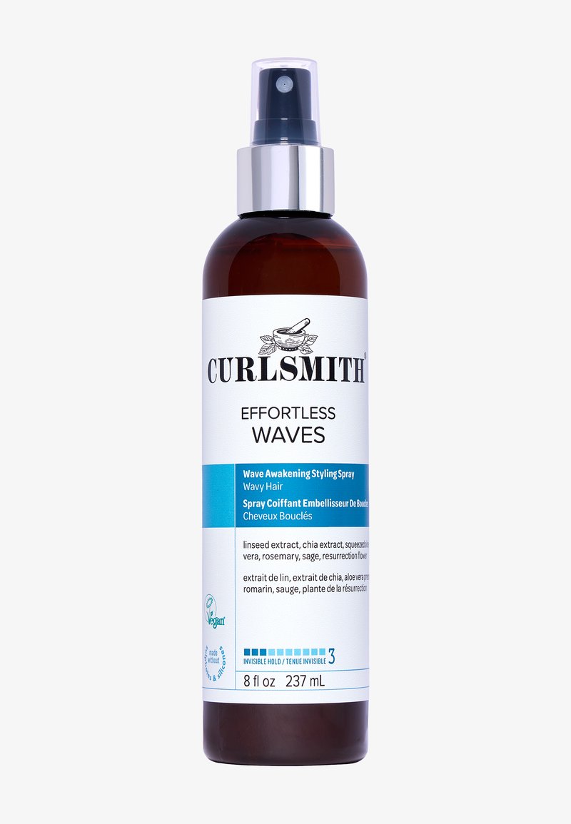 Braune Glas-Sprühflasche mit klarem Sprühkopf, beschriftet mit "Curlsmith Effortless Waves" in schwarzem und blauem Text, 8 fl oz, mit botanischen Extrakten.