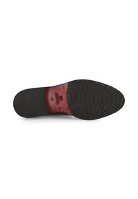 Plantilla de zapato negra con una superficie texturizada. Presenta un borde liso y un acento rojo en la parte inferior, mostrando una etiqueta de tamaño.