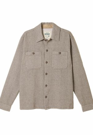 Braunes gemustertes Hemd mit Kragen, langen Ärmeln, zwei Brusttaschen und braunen Knöpfen auf der Vorderseite. Hergestellt aus strukturiertem Material.