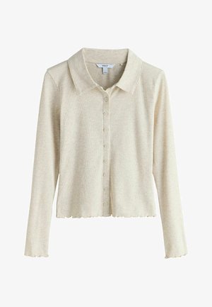 Beige ribbed long-sleeve cardigan with a collared neckline, scalloped hem, and button-down front. Soft texture and lightweight fabric.