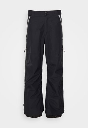 Czarne wodoodporne spodnie narciarskie o luźnym kroju, z dwiema bocznymi kieszeniami na zamek i odblaskowymi akcentami na kieszeniach. Posiadają zapięcie na guzik i zamek błyskawiczny.