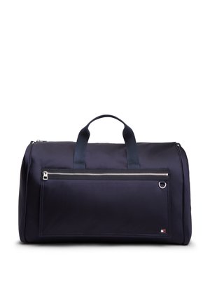 Borsa da viaggio blu navy con doppie maniglie, tasca frontale con cerniera e piccolo logo rettangolare nell'angolo in basso a destra.