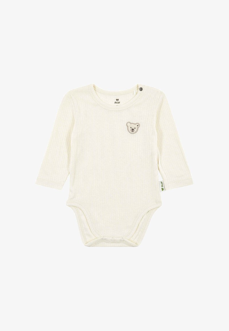 Body de manga larga color crema con textura acanalada, que presenta un bordado de cara de oso y botones a presión en el hombro y la parte inferior.