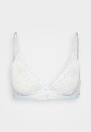 Biały bezprzewodowy stanik z trójkątnymi miseczkami o kropeczkowej fakturze. Cienkie regulowane ramiączka oraz gładka taśma u dołu.