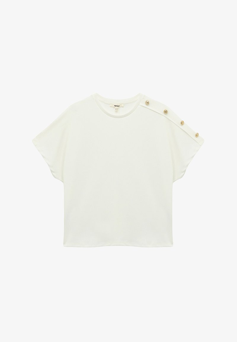 Witte t-shirt met korte mouwen in een relaxed fit, voorzien van knoopaccenten en een ronde halslijn. Zachte, gladde stof met een minimalistisch ontwerp.