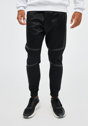 Pantalones deportivos - black