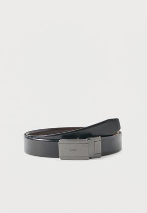 Black leather belt with a rectangular silver buckle engraved with "BOSS," laid in a loose coil on a plain white background.