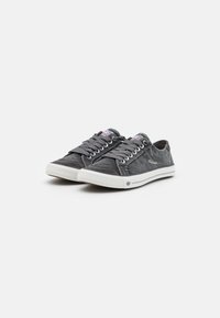 Gray canvas sneakers with white rubber sole. Features lace-up front, contrasting stitching, and branded accents on tongue and side.