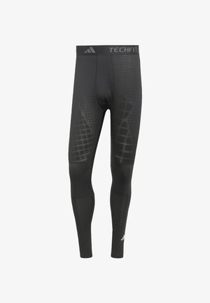 Leggings atletici Black TechFit realizzati in materiale elasticizzato. Presentano un motivo a griglia testurizzato e una cintura con logo di marca.