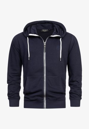 Navy zip-up hoodie with white drawstrings, kangaroo pocket, and ribbed cuffs. Soft fabric with a logo detail on the chest.