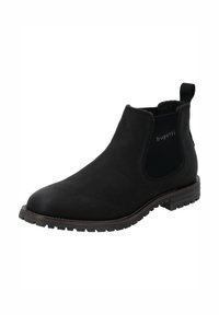 Botas Chelsea de cuero negro con paneles laterales elásticos, puntera redonda, suela de goma texturizada y un tacón bajo apilado. Logo de la marca visible.