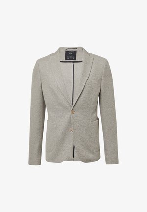 Lichtgrijze blazer van gestructureerde stof. Voorzien van een sluiting met één knoop, twee voorzakken en een notch revers. Contrastvoering aan de binnenkant.