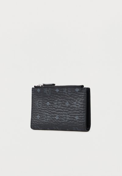 Black textured leather wallet with a zip closure, featuring a subtle pattern. Compact rectangular shape with defined edges.