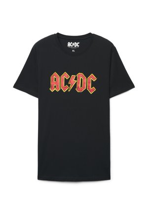 Czarny bawełniany T-shirt z dużym, wyraźnym graficznym nadrukiem AC/DC w kolorach czerwonym i żółtym, z akcentem błyskawicy na środku. Rozmiar XL.