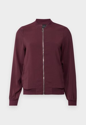 Burgundy bomber jacket with a zip front, round neckline, and ribbed cuffs. Made from smooth fabric with a simple, classic design.