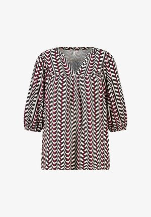 Losse blouse met driekwart pofmouwen, V-hals kraag en zigzagpatroon in zwart, wit en bordeaux.