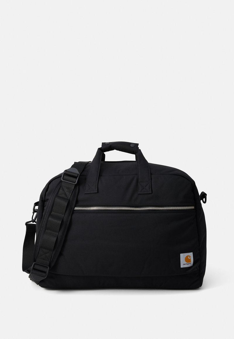 Sac de sport noir en tissu résistant, doté de deux poignées supérieures, d'une bandoulière réglable, d'un zip argenté et d'un petit patch logo.