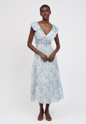 Maxikleid mit Blumenmuster in Creme und Blau. Mit Rüschenärmeln, V-Ausschnitt und einem Taillenzug. Hergestellt aus leichtem Stoff.