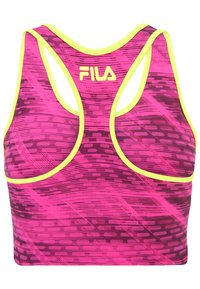 FILA sportbh i rosa med ett vågigt mönster och gula detaljer. Har en racerback-design och sömlös konstruktion för komfort.