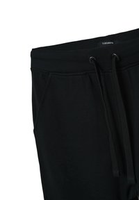 Czarne spodnie dresowe z elastycznym paskiem ze sznurkiem, z bocznymi kieszeniami i miękką teksturą, oznaczone etykietą "Terranova" na pasie.