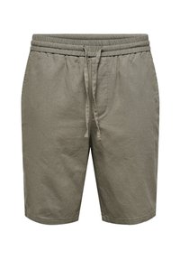 Pantaloni scurți de culoare verde măsliniu deschis, din bumbac texturat. Au un brâu elastic cu șnur, două buzunare laterale și o croială dreaptă.