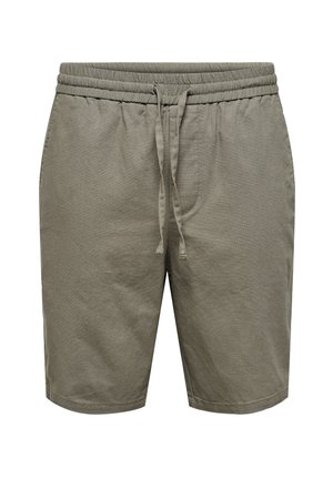 Shorts d'un vert olive clair en coton texturé. Ils présentent une taille élastique avec un cordon de serrage, deux poches latérales et une coupe droite.