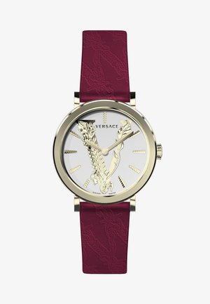 Gold-tone watch with a round silver dial featuring a prominent V design and engraved details; burgundy textured leather strap.