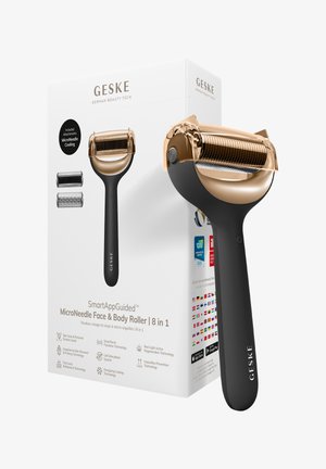 Rouleur pour visage et corps GESKE MicroNeedle avec poignée noire et tête de rouleau dorée, présenté avec emballage et deux accessoires supplémentaires.