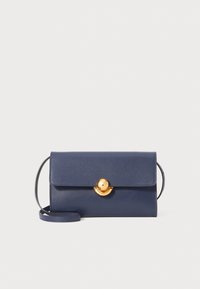 Navy leather handbag with a structured design, featuring a gold circular clasp and a detachable shoulder strap. Smooth texture and clean lines.