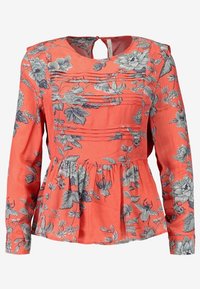 Koralowa bluzka z długim rękawem w kwiatowy wzór; posiada detal plisowania, okrągły dekolt i marszczony dół w stylu peplum. Miękka tekstura materiału.