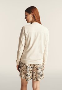 Freddy E COLLO IN CON DETTAGLI ANIMALIER - Sudadera con cremallera - white sand zebra animalier