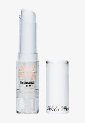Tube de baume à lèvres cylindrique transparent avec un mécanisme à vis ; embout de produit blanc, corps transparent et texte imprimé en pêche et noir.